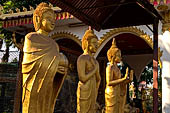 Vientiane, Laos - Pha That Luang, various Buddha statues among the Other structures on the ground. 